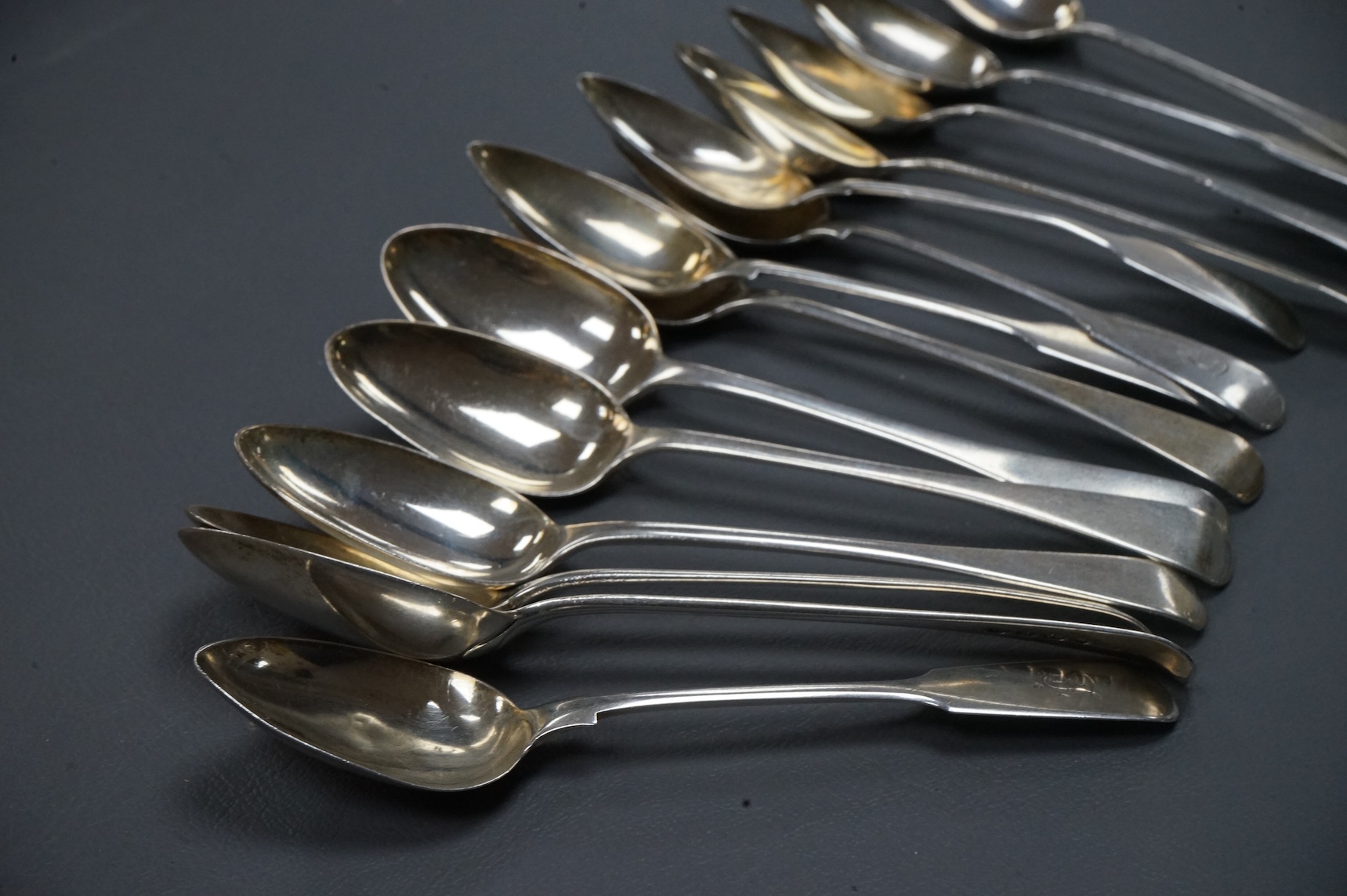 A set of eight George IV silver Old English pattern teaspoons, William Eaton, London 1827, 14.2cm, together with a set of six early Victorian provincial silver fiddle pattern teaspoons, by John Walton, Newcastle, 1842, 7